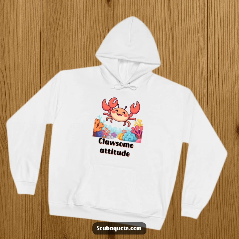 Funny hoodie depicting a smiling crab with its claws extended, confidently moving through a detailed and colorful coral reef.