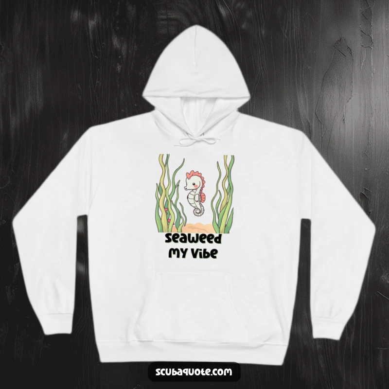 Funny hoodie showcasing a content seahorse calmly drifting through swaying seaweed, offering warmth and a sense of tranquil underwater escape.
