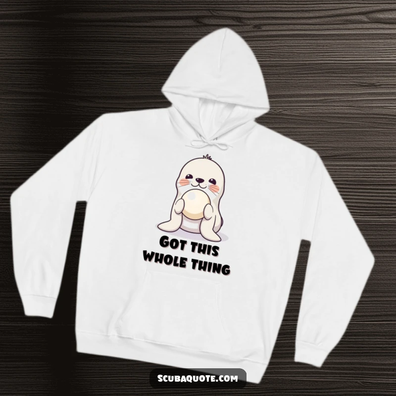 Funny hoodie showcasing a playful seal balancing a ball on its nose, offering warmth and a touch of circus-inspired fun.